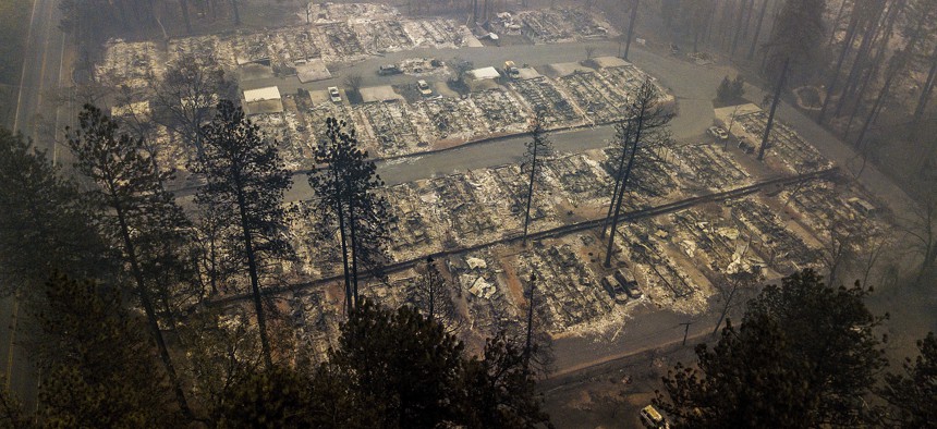 In this Nov. 15, 2018, file photo, residences leveled by the wildfire line a neighborhood in Paradise, Calif. 