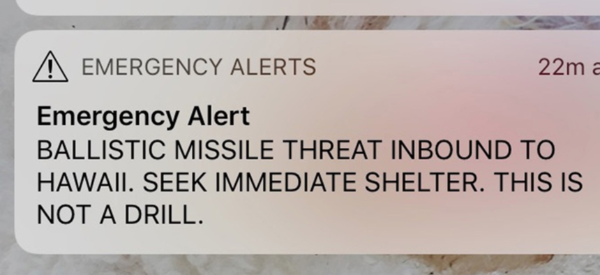 A smartphone screen capture showing a false incoming ballistic missile emergency alert sent from the Hawaii Emergency Management Agency system.