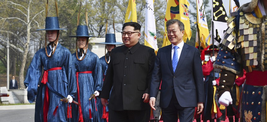 North Korean leader Kim Jong Un, left, and South Korean President Moon Jae-in walk together at the border village of Panmunjom in the Demilitarized Zone Friday, April 27, 2018.