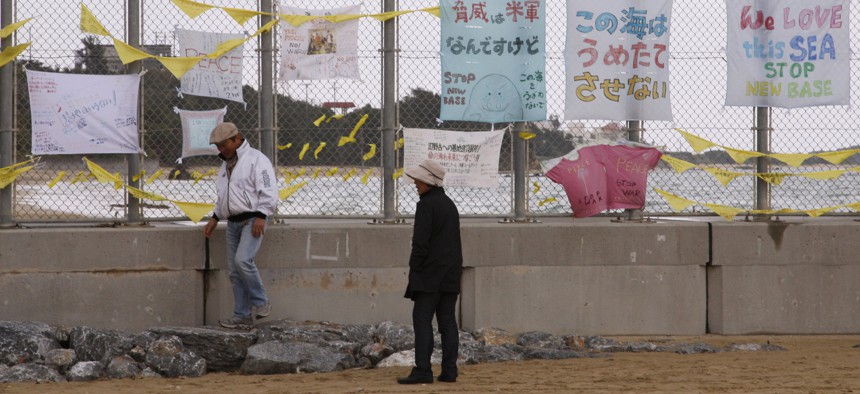 A 2014 shows banners hung to protest the move of U.S. Marine Corps forces from Okinawa to Henoko, Japan.