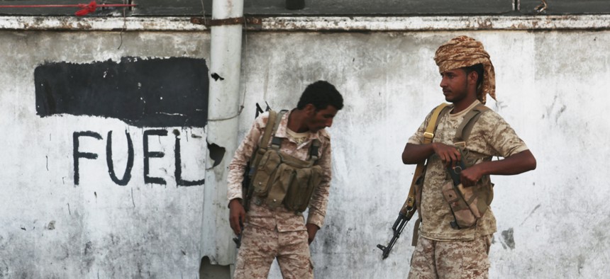 Two Yemeni soldiers stand guard in Mukalla, Yemen, Thursday, Nov. 29, 2018.