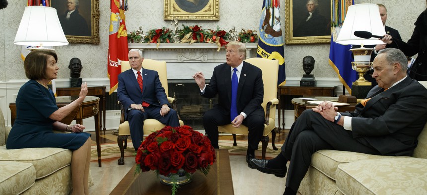 House Minority Leader Rep. Nancy Pelosi, D-Calif., Vice President Mike Pence, President Donald Trump, and Senate Minority Leader Chuck Schumer, D-N.Y., argue during a meeting in the Oval Office of the White House, Dec. 11, 2018.