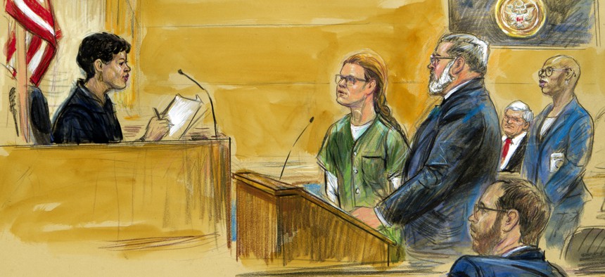 In this courtroom sketch, Maria Butina, left, is shown next to her attorney Robert Driscoll, before U.S. District Judge Tanya Chutkan, during a court hearing at the U.S. District Court in Washington, Thursday, Dec. 13, 2018. 