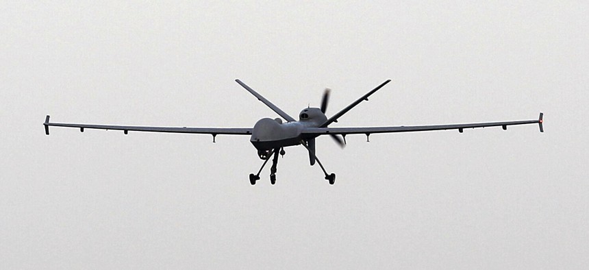 A Predator B unmanned aircraft lands after a mission at the Naval Air Station, Tuesday, Nov. 8, 2011, in Corpus Christi, Texas.