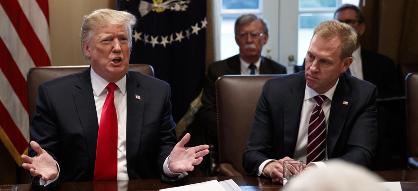Acting Secretary of Defense Patrick Shanahan, right, listens as President Donald Trump speaks during a cabinet meeting at the White House, Wednesday, Jan. 2, 2019, in Washington.