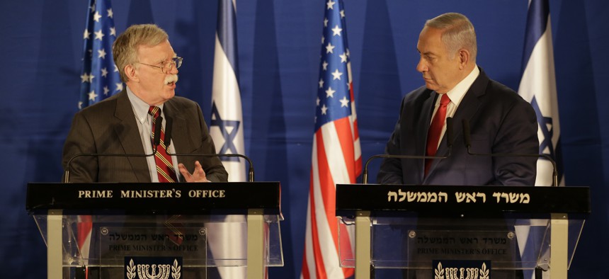 US National Security Advisor John Bolton, left, speaks to Israeli Prime Minister Benjamin Netanyahu during a joint statement to the media follow their meeting, in Jerusalem, Sunday, Jan. 6, 2019.