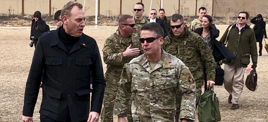 Acting Defense Secretary Pat Shanahan, left, arrives in Kabul, Afghanistan, Monday morning, Feb. 11, 2019, to consult with Army Gen. Scott Miller, right, commander of U.S. and coalition forces, and senior Afghan government leaders.