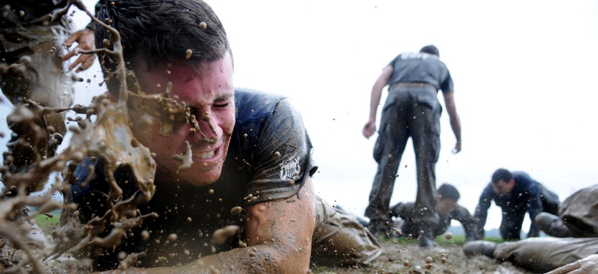 A first-year midshipman, or plebe, is splashed with mud while participating in Sea Trials May 15, 2012, at the U.S. Naval Academy in Annapolis, Md.