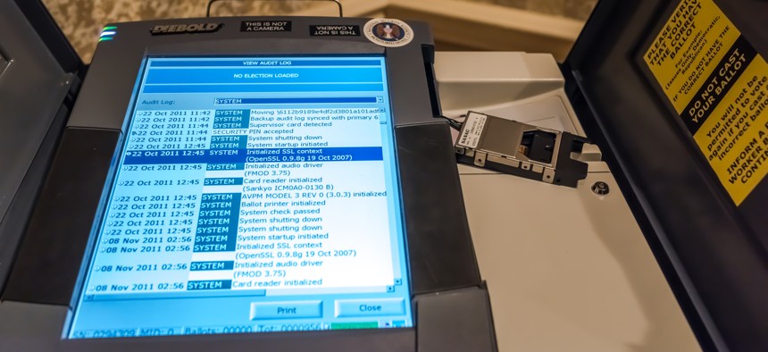 A hacked voting machine is on display at the 25th defcon hacker conference held at Caesar Palace July 27 - 30, showing security component has not been patched since 2007.
