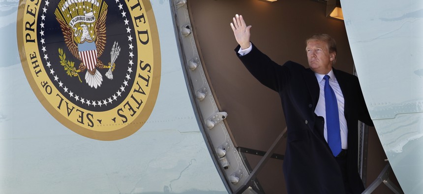 President Donald Trump waves while boarding Air Force One for a trip to Vietnam to meet with North Korean leader Kim Jong Un, Monday, Feb. 25, 2019, in Andrews Air Force Base, Md.