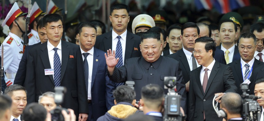 North Korean leader Kim Jong Un waves upon arrival by train in Dong Dang in Vietnamese border town Tuesday, Feb. 26, 2019