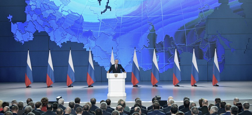 Russian President Vladimir Putin, center, delivers a state-of-the-nation address in Moscow, Russia, Wednesday, Feb. 20, 2019.
