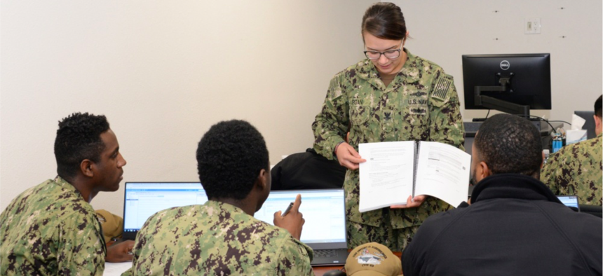 Electronics Technician 2nd Class Makayla Burgan, Security Plus Lead Instructor teaches fleet students VMWare software applications for the shipboard Consolidated Afloat Network Enterprise Services (CANES) system. 