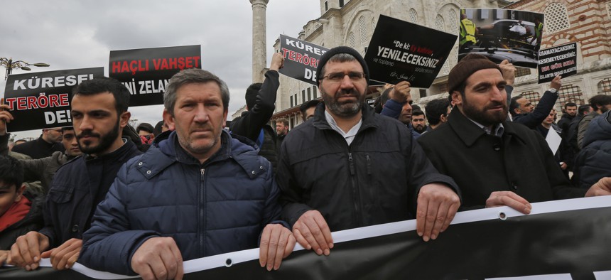 Demonstrators march after the mosque attacks in New Zealand, during a protest in Istanbul, Friday, March 15, 2019.