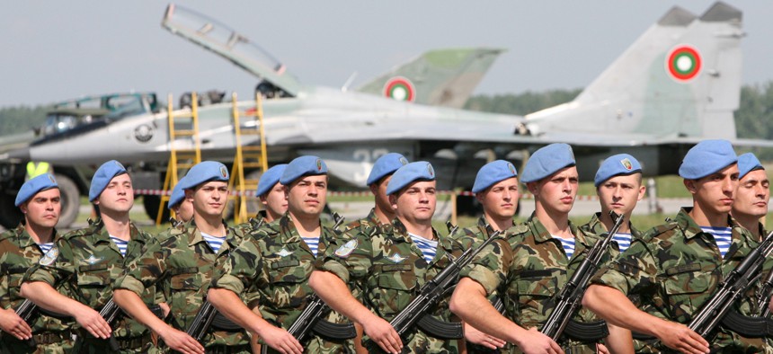 Bulgarian special forces soldiers parade walk in front of the Mig-29 jet fighter, during an open air show in the military air base of Graf Ignatievo east of the Bulgarian capital Sofia, Friday, June, 1, 2007.