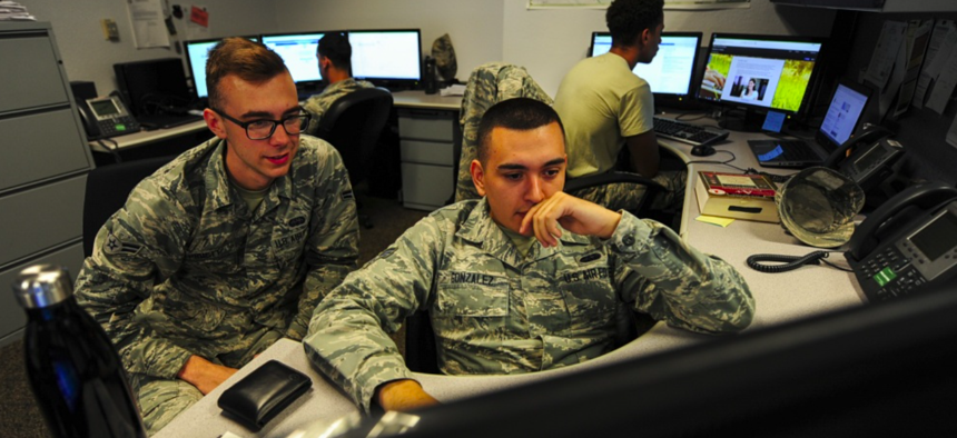 U.S. Air Force cyber security technicians with the 355th Communications Squadron review work orders at Davis-Monthan Air Force Base Ariz., Sept. 26, 2018.