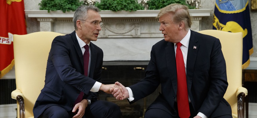 President Donald Trump shakes hands with with NATO Secretary General Jens Stoltenberg during a meeting in the Oval Office of the White House, Tuesday, April 2, 2019, in Washington. 