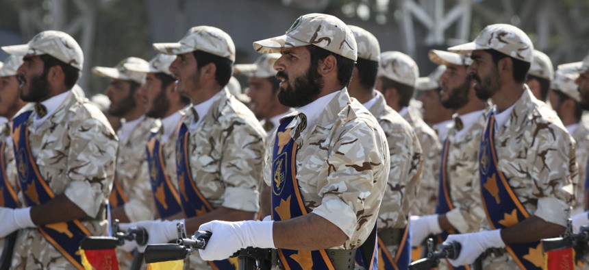 In this Sept. 22, 2011 photo, members of Iran's Revolutionary Guard march in front of the mausoleum of the late Iranian revolutionary founder Ayatollah Khomeini, just outside Tehran, Iran, during armed an forces parade.