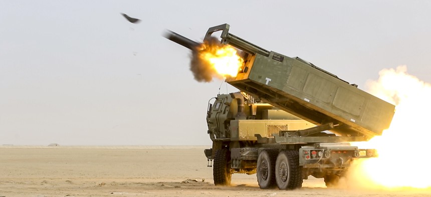 U.S. soldiers fire a High Mobility Artillery Rocket System during an exercise in Kuwait.