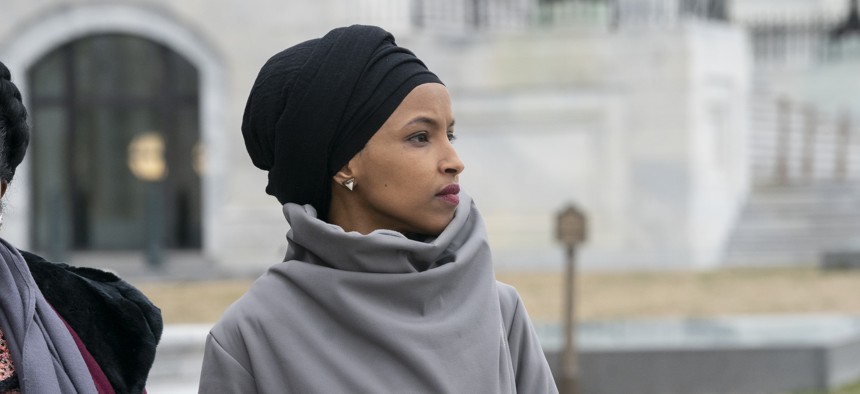 Rep. Ilhan Omar, D-Minn., stands outside the Capitol in Washington, Friday, March 8, 2019.