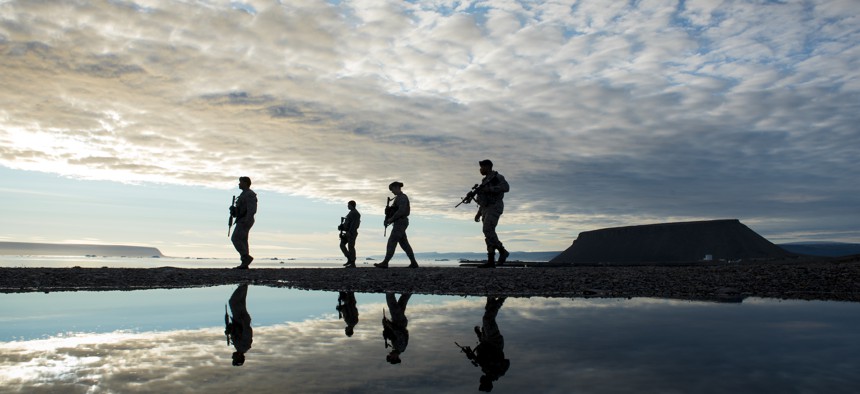 821st Security Forces Squadron members, walk back to their vehicle after responding to a training exercise at Thule Air Base, Greenland, Aug. 16, 2018.
