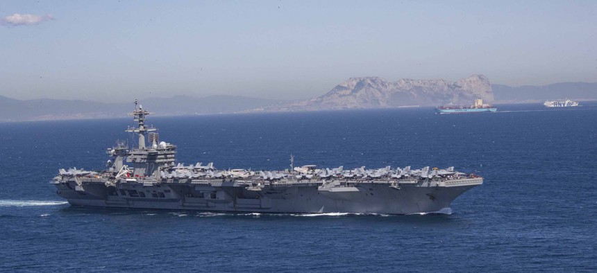 The Nimitz-class aircraft carrier USS Abraham Lincoln (CVN 72) transits the Strait of Gibraltar, 