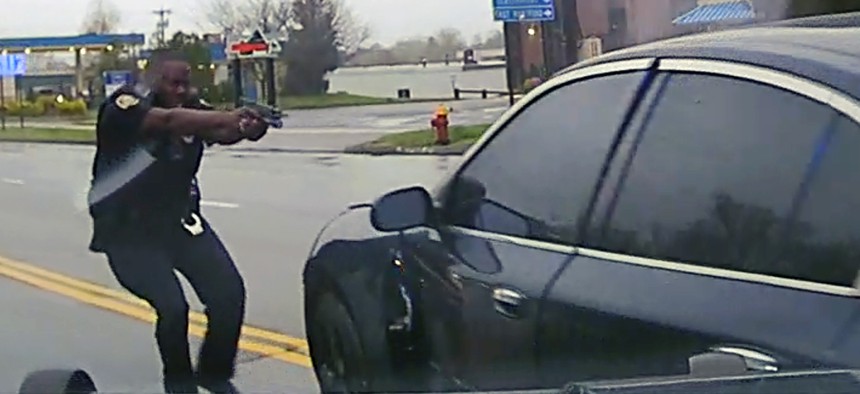 This still image from police dash camera video shows Police Officer Layau Eulizier on April 20 in Wethersfield, Conn., just before he fired through the window.