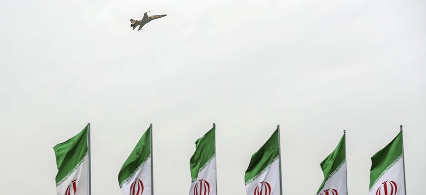 A fighter jet flies over Iranian flags during the army parade commemorating National Army Day in front of the shrine of the late revolutionary founder Ayatollah Khomeini, just outside Tehran, Iran, Thursday, April 18, 2019.