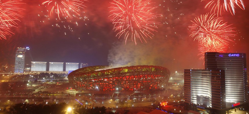 Fireworks explodes over the National Stadium during the closing ceremony for the 2008 Beijing Olympics in Beijing, Sunday, Aug. 24, 2008.