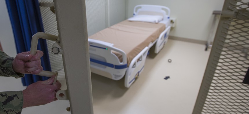 In this photo reviewed by U.S. military officials, a hospital bed is shown inside the converted Camp V detention facility, Wednesday, April 17, 2019, in Guantanamo Bay Naval Base, Cuba. 