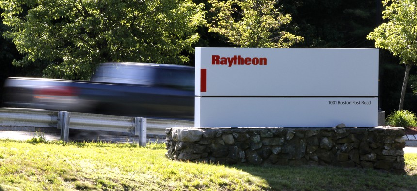 Workers drive into the Raytheon facility Monday, June 10, 2019, in Marlborough. 