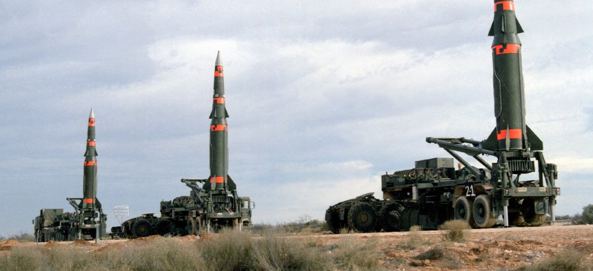 Several U.S. Pershing II intermediate-range ballistic missiles are prepared for launching at Fort Bliss's McGregor Range in New Mexico in December 1987.