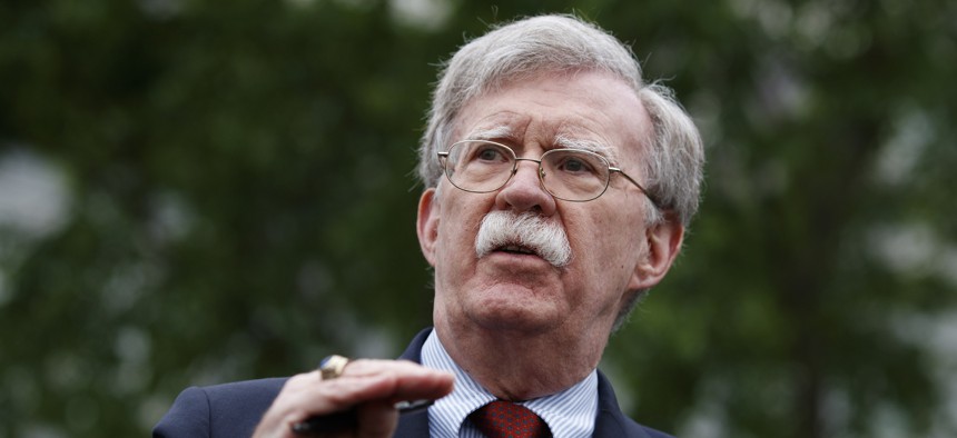 National security adviser John Bolton talks to reporters about Venezuela, outside the White House, Wednesday, May 1, 2019, in Washington.