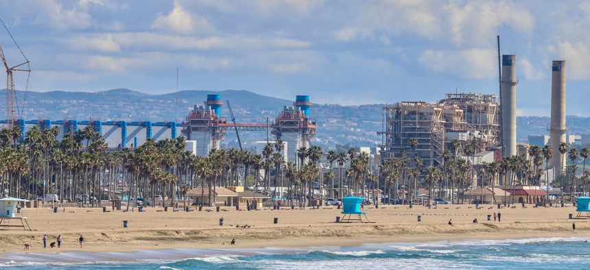 A desalinization plant sits just beyond the shoreline in Huntington Beach, California.