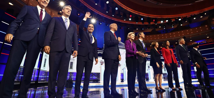 Candidates pose on stage before the Democratic primary debate hosted by NBC News, Wednesday, June 26, 2019, in Miami.