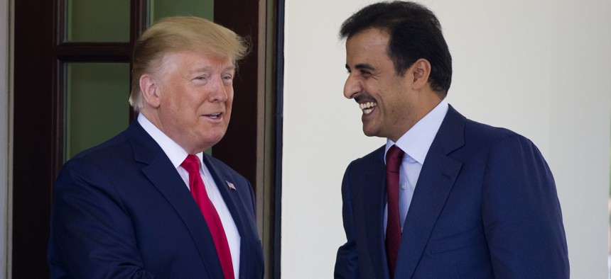President Donald Trump shakes hands as he welcomes Qatar's Emir Sheikh Tamim bin Hamad Al Thani upon his arrival at the White House, Tuesday, July 9, 2019, in Washington.