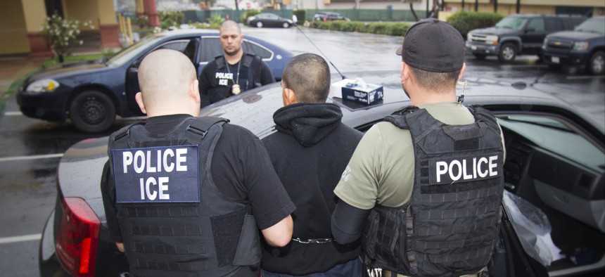 In this Feb. 7, 2017, photo released by U.S. Immigration and Customs Enforcement, foreign nationals are arrested during a targeted enforcement operation in Los Angeles.