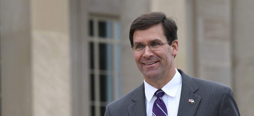 In this July 8, 2019, photo, acting Secretary of Defense Mark Esper waits for the arrival of Qatar's Emir Sheikh Tamim bin Hamad Al Thani to the Pentagon. 