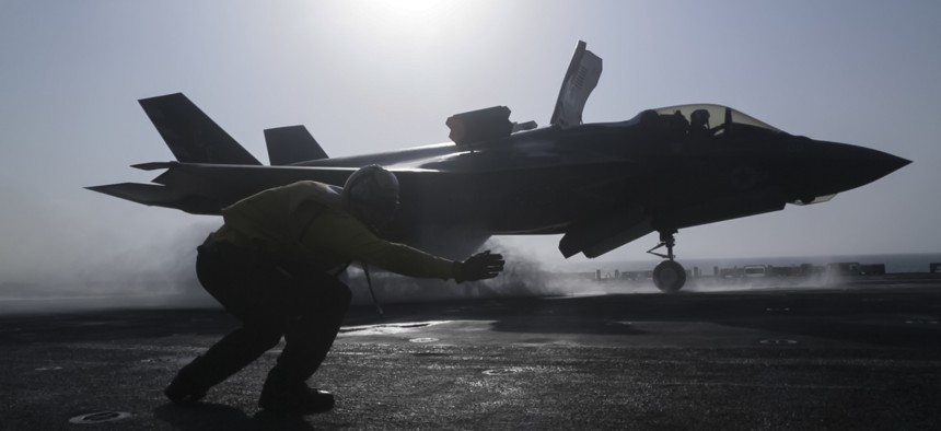 U.S. Navy Petty Officer 1st Class Rey White, an aviation boatswains mate handler with the Essex Amphibious Ready Group (ARG), launches an F-35B Lightning II with Marine Fighter Attack Squadron 211, 13th Marine Expeditionary Unit (MEU).