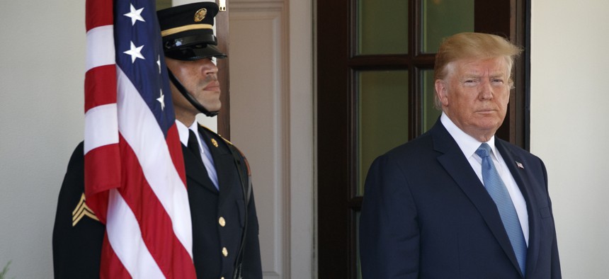 President Donald Trump waits to greet Pakistan's Prime Minister Imran Khan as he arrives at the White House, Monday, July 22, 2019, in Washington.