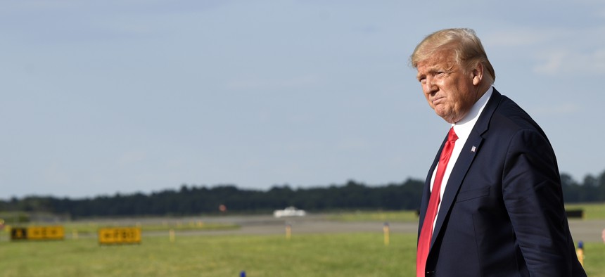 President Donald Trump walks towards Marine One at Morristown Municipal Airport in Morristown, N.J., Friday, Aug. 9, 2019, to take the short trip to his golf club where he will be vacationing for a week.