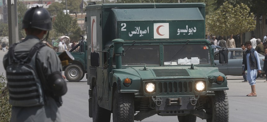 An Afghan military ambulance rushes towards the site of an explosion that wounded dozens of people in Kabul, Afghanistan, on Aug. 7, 2019. The Taliban claimed responsibility for the attack.