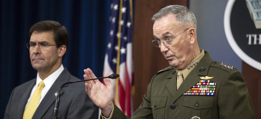 Joint Chiefs Chairman Gen. Joseph Dunford with Secretary of Defense Mark Esper speaks to reporters during a briefing at the Pentagon, Wednesday, Aug. 28, 2019