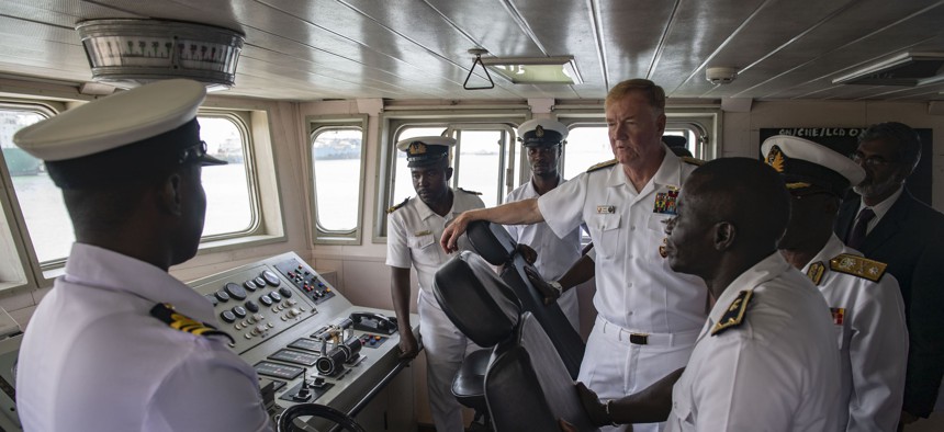 Adm. James G. Foggo III, center right, commander of U.S. Naval Forces Europe and Africa, tours the bridge of the Ghanaian navy ship GNS Chemle (P 36) during a site visit to Sekondi, Ghana, July 23, 2019.