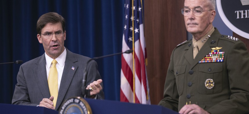 Secretary of Defense Mark Esper and Joint Chiefs Chairman Gen. Joseph Dunford speak to reporters during a briefing at the Pentagon, Wednesday, Aug. 28, 2019. 