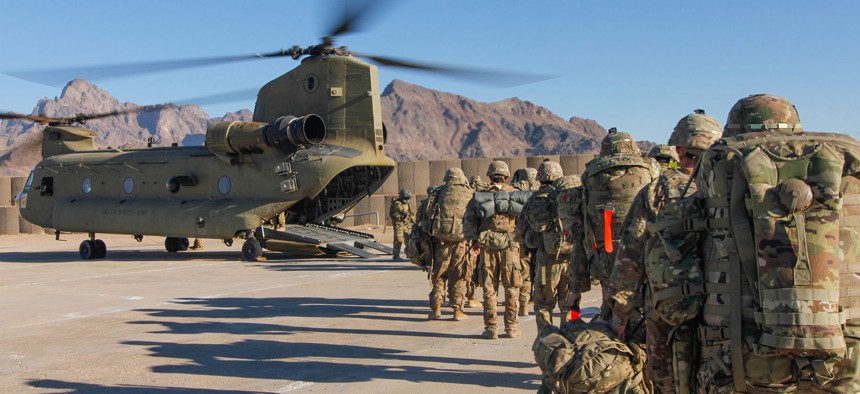 Soldiers assigned to the 101st Resolute Support Sustainment Brigade load onto a Chinook helicopter to head out and execute missions across Afghanistan, Jan. 15, 2019.