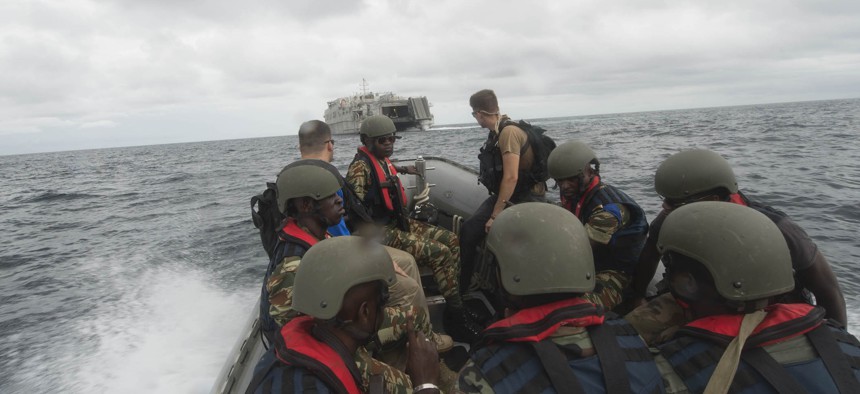 A rigid hull inflatable boat makes for USNS Spearhead in the Gulf of Guinea during a passenger exchange of Gabon Navy Sailors and Gendarmerie members during a boarding exercise, March 19, as part of Exercise Obangame/Saharan Express 2016.