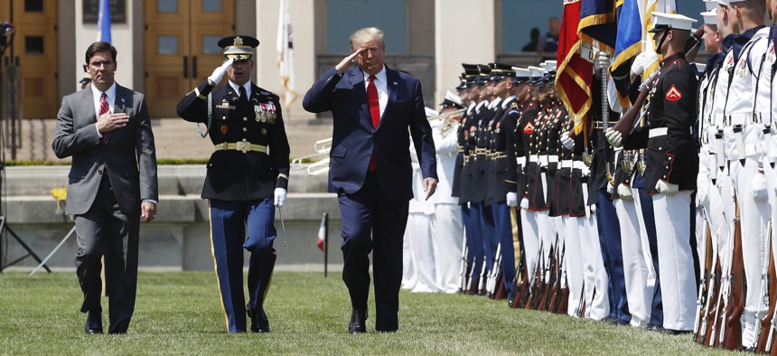President Donald Trump, right, and Secretary of Defense Mark Esper, left, salute the flags, during a full honors welcoming ceremony for Esper at the Pentagon, Thursday, July 25, 2019, in Washington.