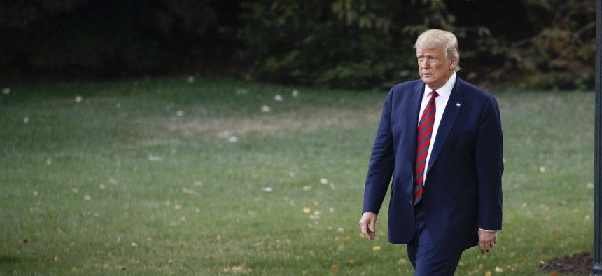 President Donald Trump walks out of the Oval Office before speaking with reporters and departing on Marine One from the South Lawn of the White House, Thursday, Sept. 12, 2019