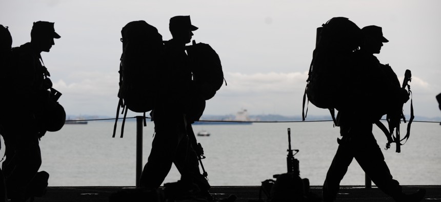 Marines serving with the 11th Marine Expeditionary Unit prepare to depart USS Makin Island to begin a training exercise in 2011.